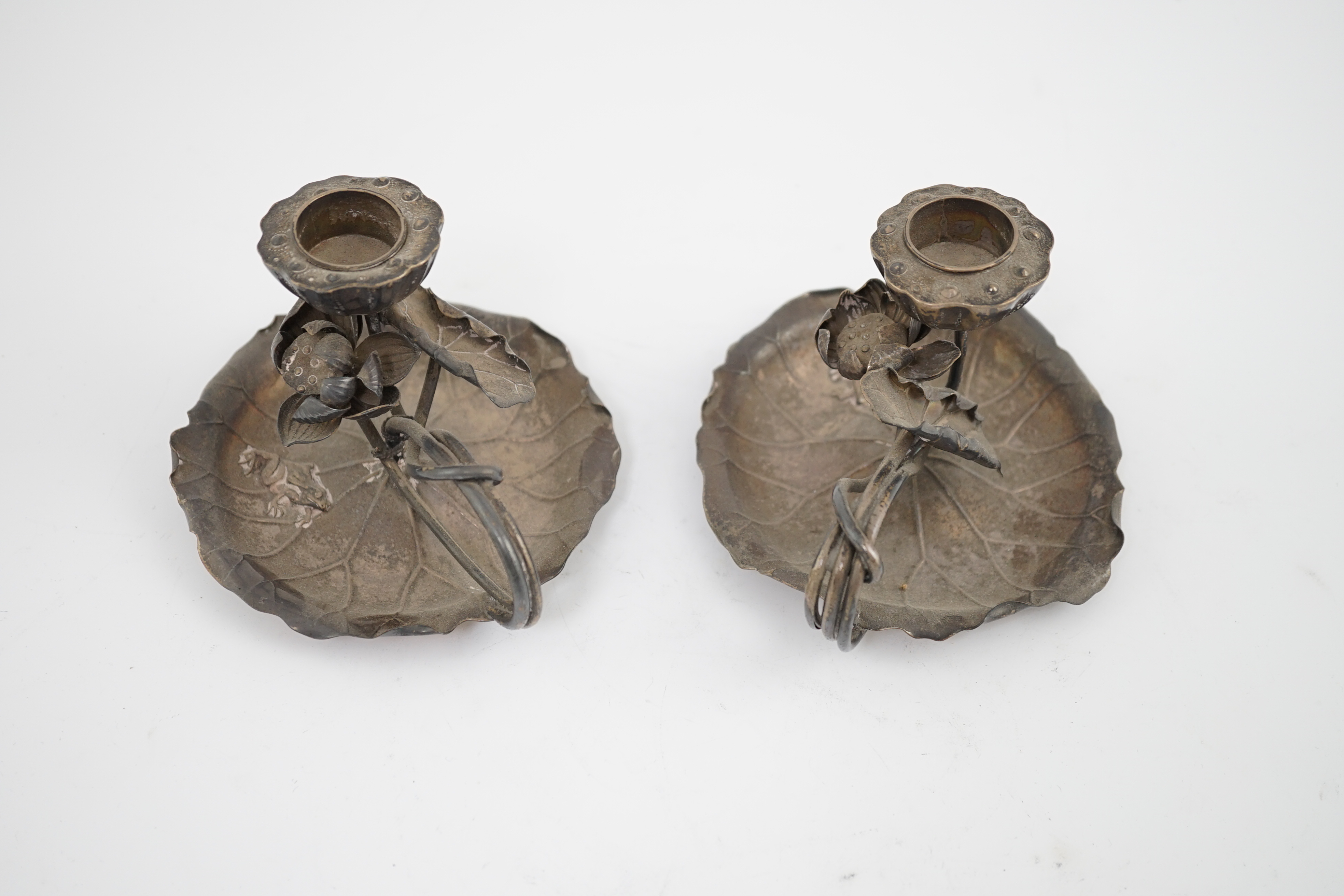 A pair of early 20th century Japanese silver chamber sticks